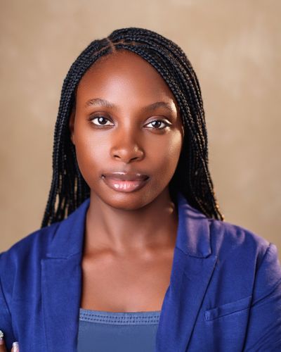 Portrait of a confident young woman in a blue blazer
