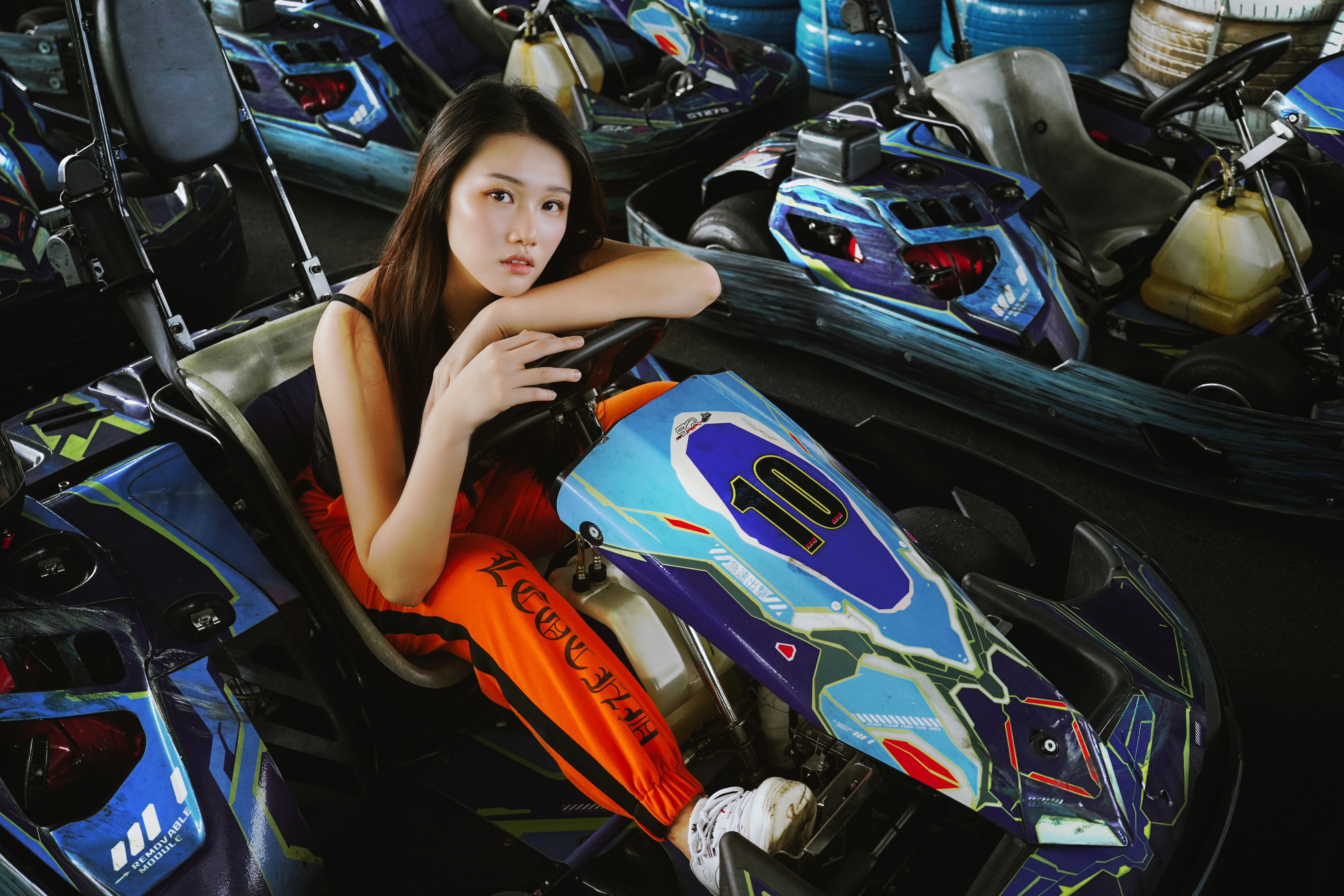 Young Woman in a Go-Kart at Indoor Track