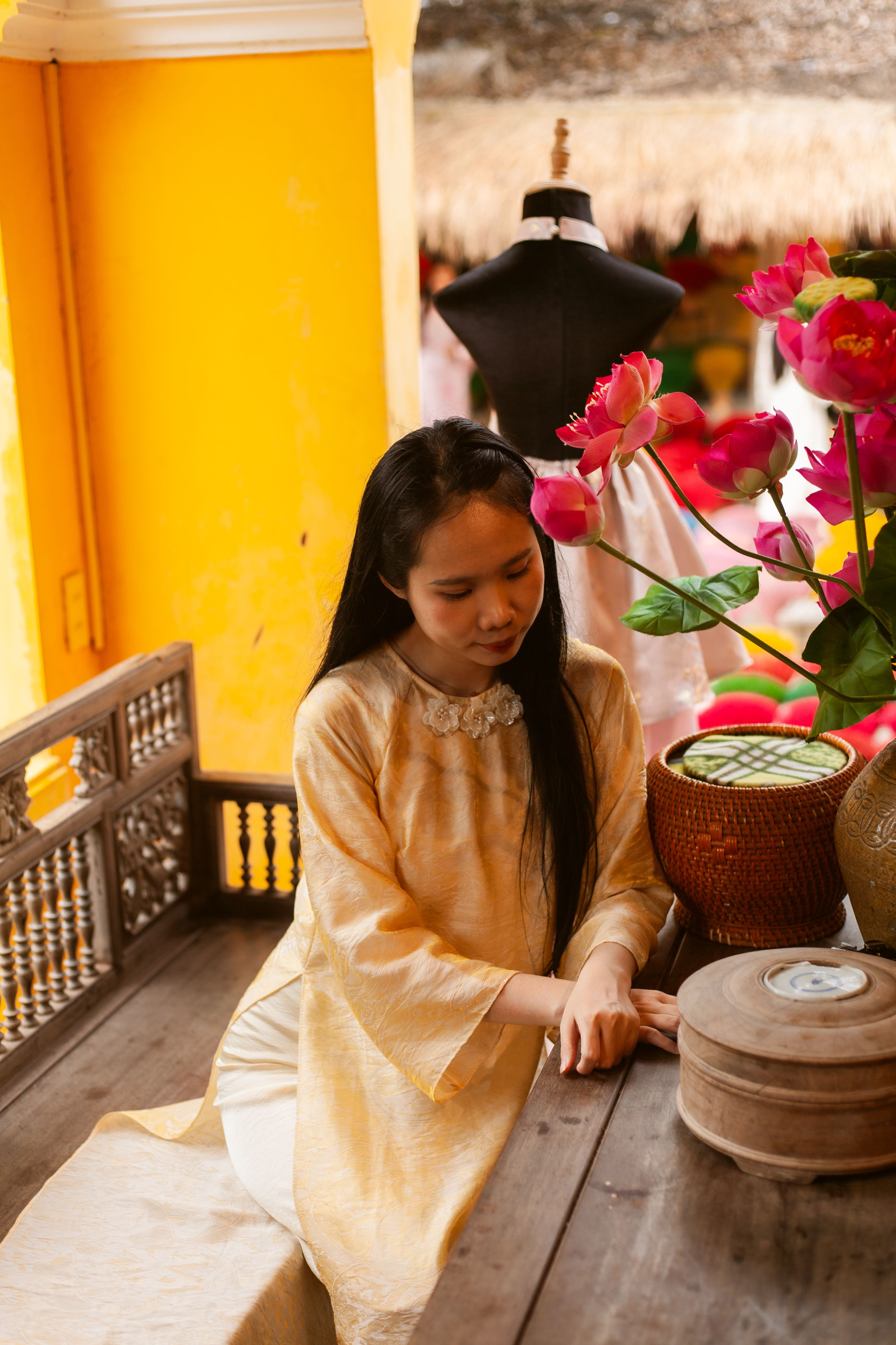 Elegant Woman in Traditional Dress with Flowers · Free Stock Photo