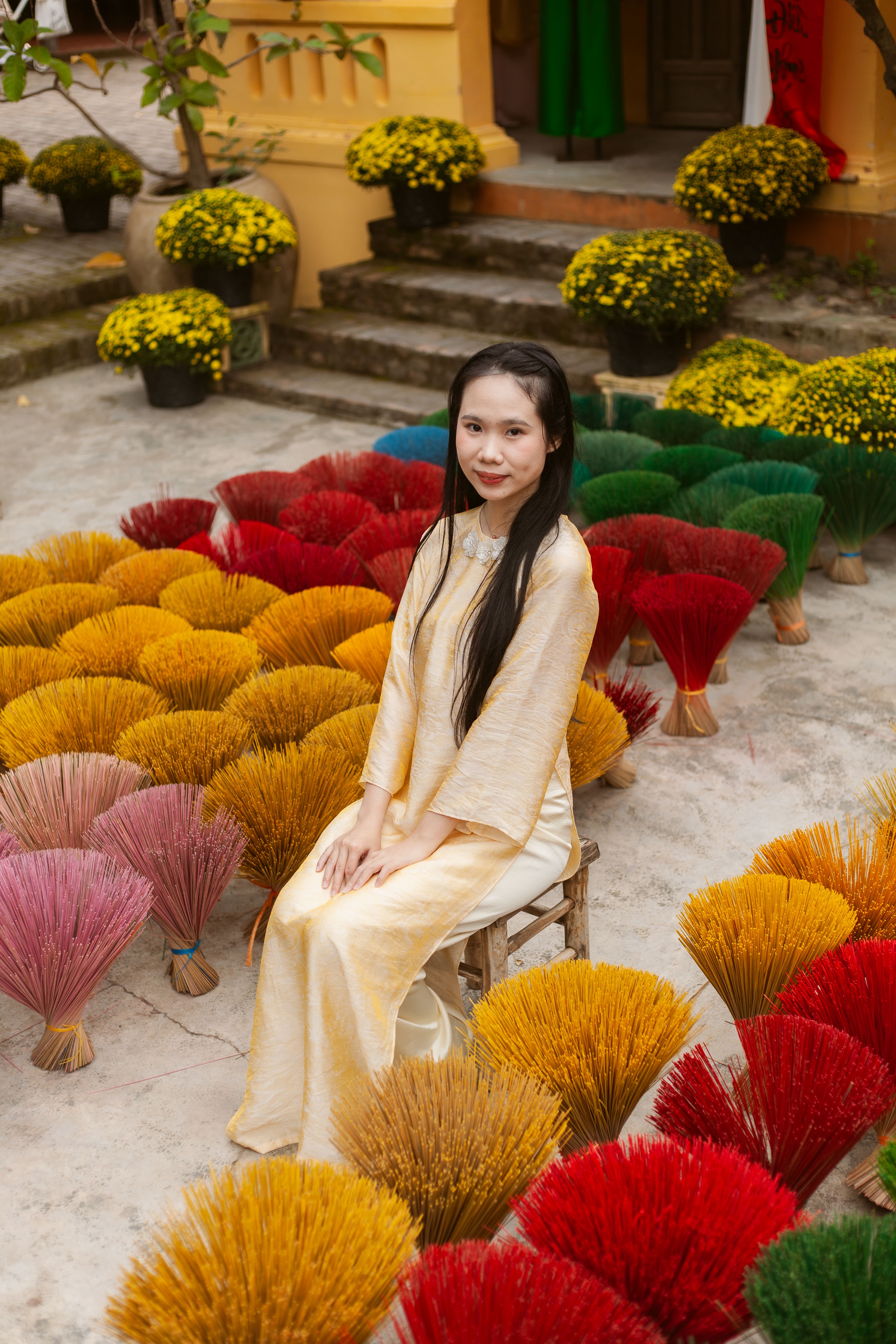Vietnamese Woman Amidst Colorful Incense Sticks · Free Stock Photo