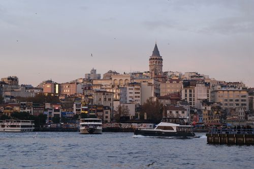 Free A beautiful dusk view of Istanbul featuring the iconic Galata Tower and waterfront. Stock Photo