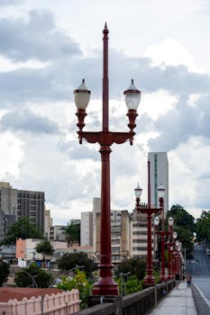 Classic street lamps line a scenic bridge in Belo Horizonte, capturing urban aesthetics.