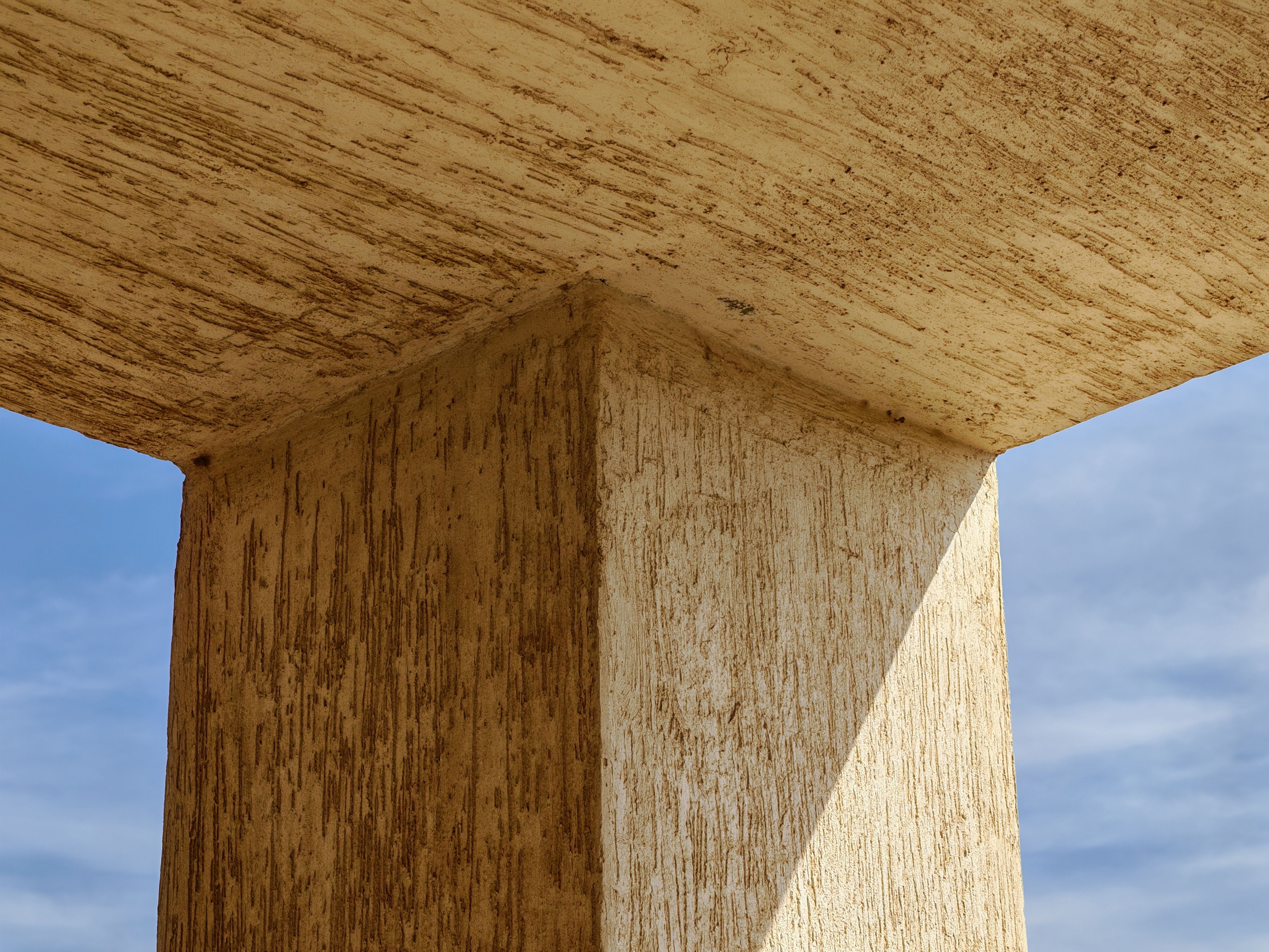 Abstract Architectural Column Against Blue Sky · Free Stock Photo