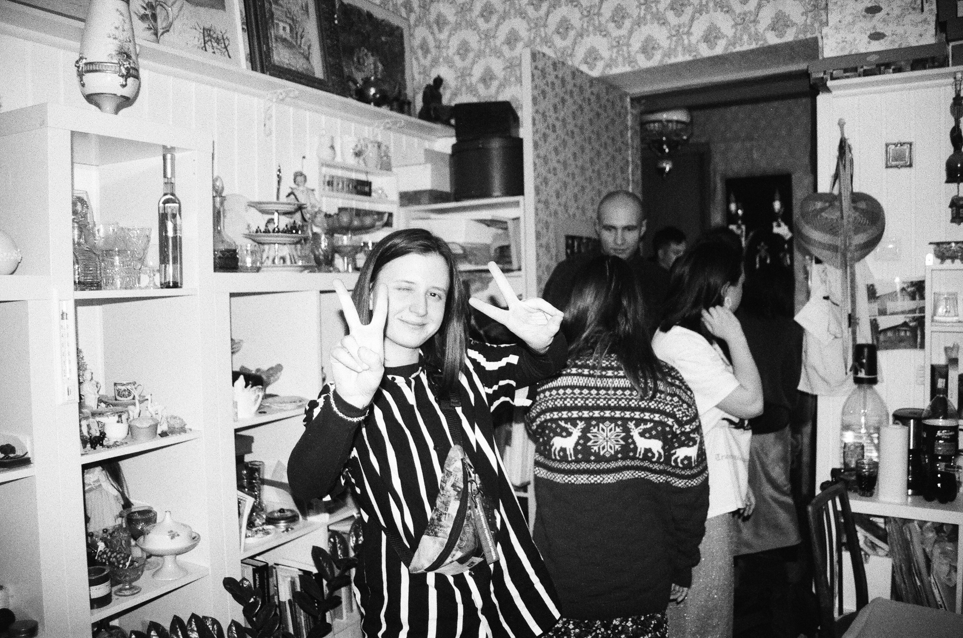 A lively indoor scene featuring friends enjoying a casual gathering.