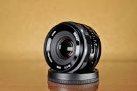 Close-up of Meike 35mm Camera Lens on Table