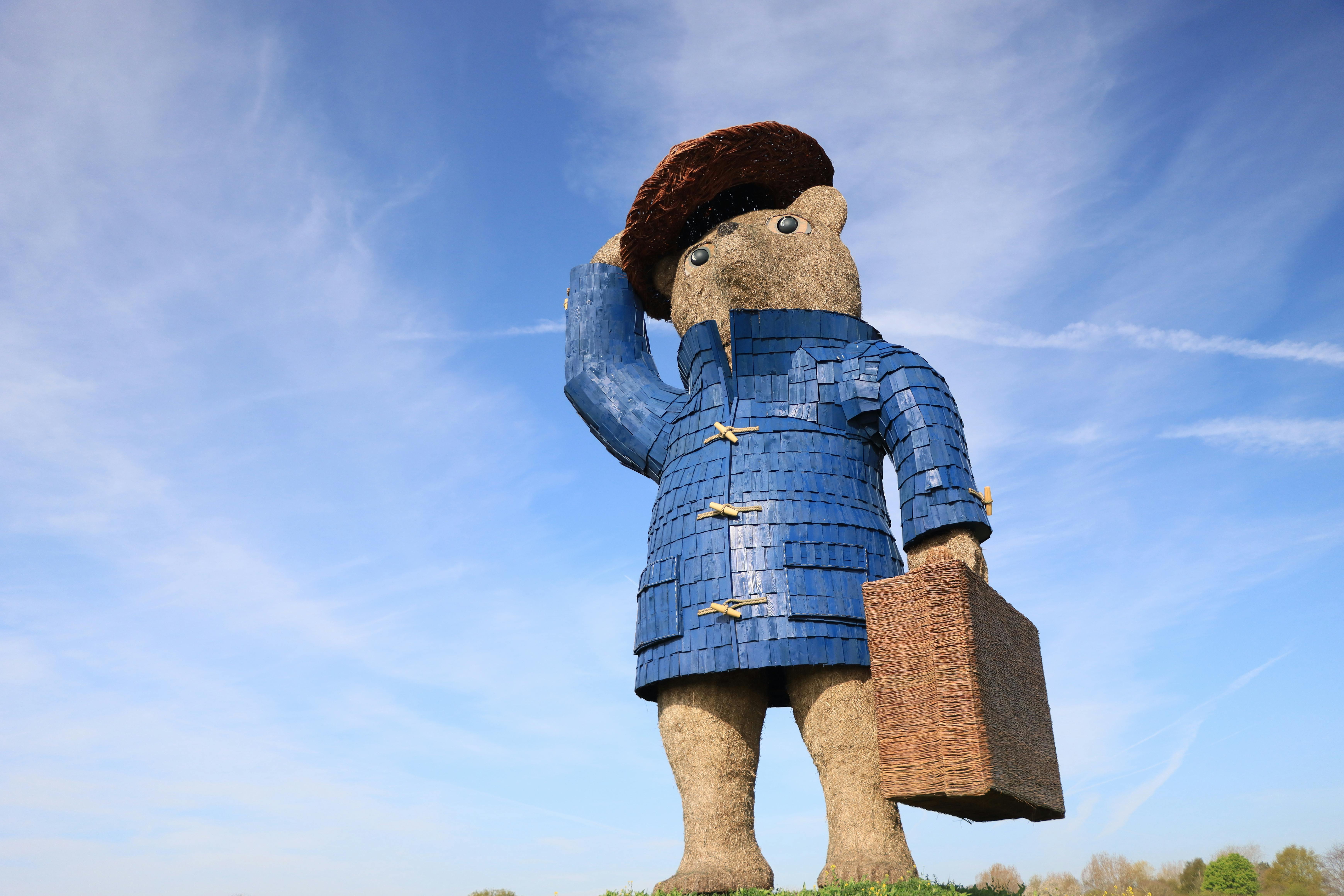 Family using smart suitcase with app-controlled lock and tracking on busy international terminal