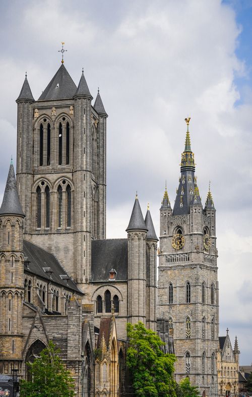 Free Historic Gothic cathedral towers under a cloudy sky in Ghent, Belgium. Stock Photo