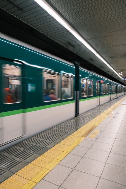 Free Motion blur of a fast-moving train in a subway station in Kyoto, Japan. Stock Photo
