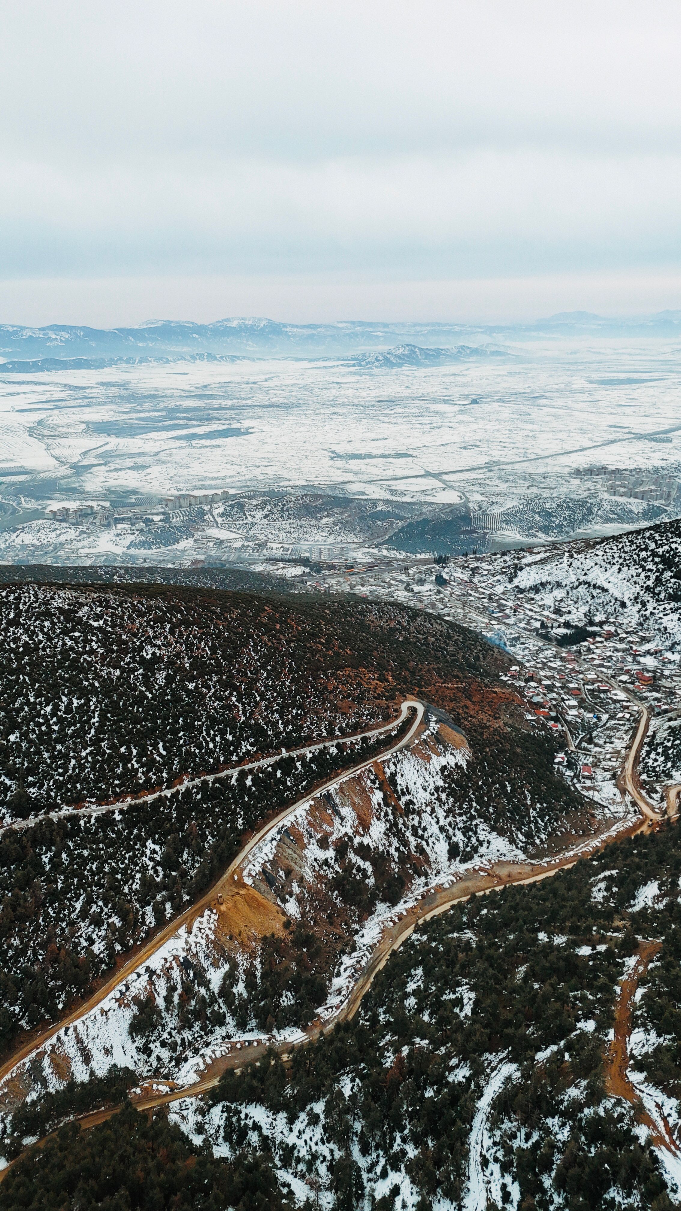Aerial View of Snow-Covered Mountain and Road · Free Stock Photo