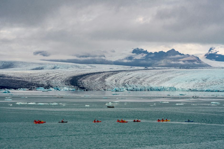 People glacier hiking in Iceland, highlighting adventure sports coverage