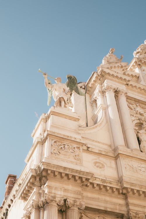Ornate Angel Statue on Historical Building · Free Stock Photo