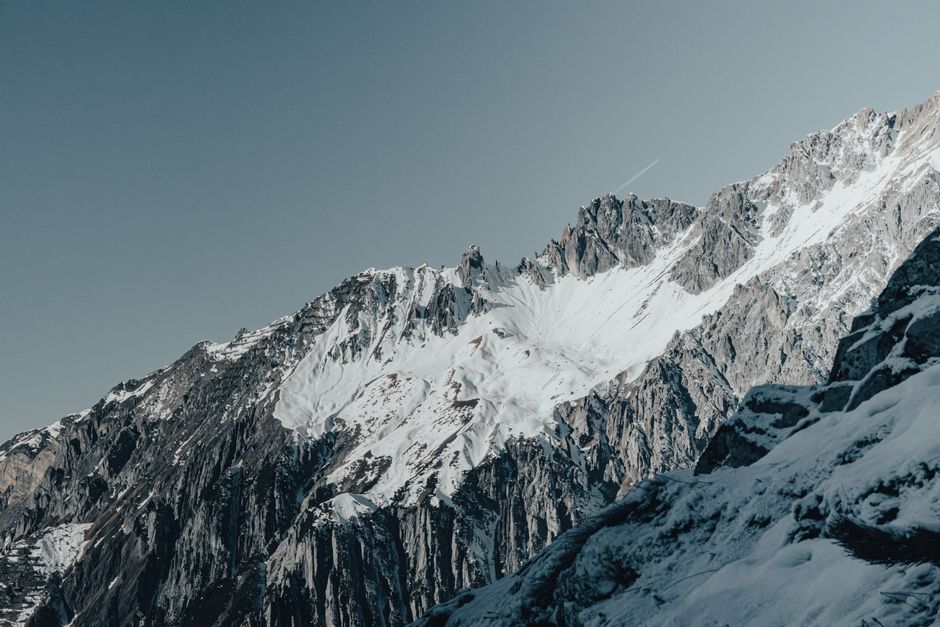 Stunning aerial panorama of the snow-covered peaks in the Austrian Alps during winter.