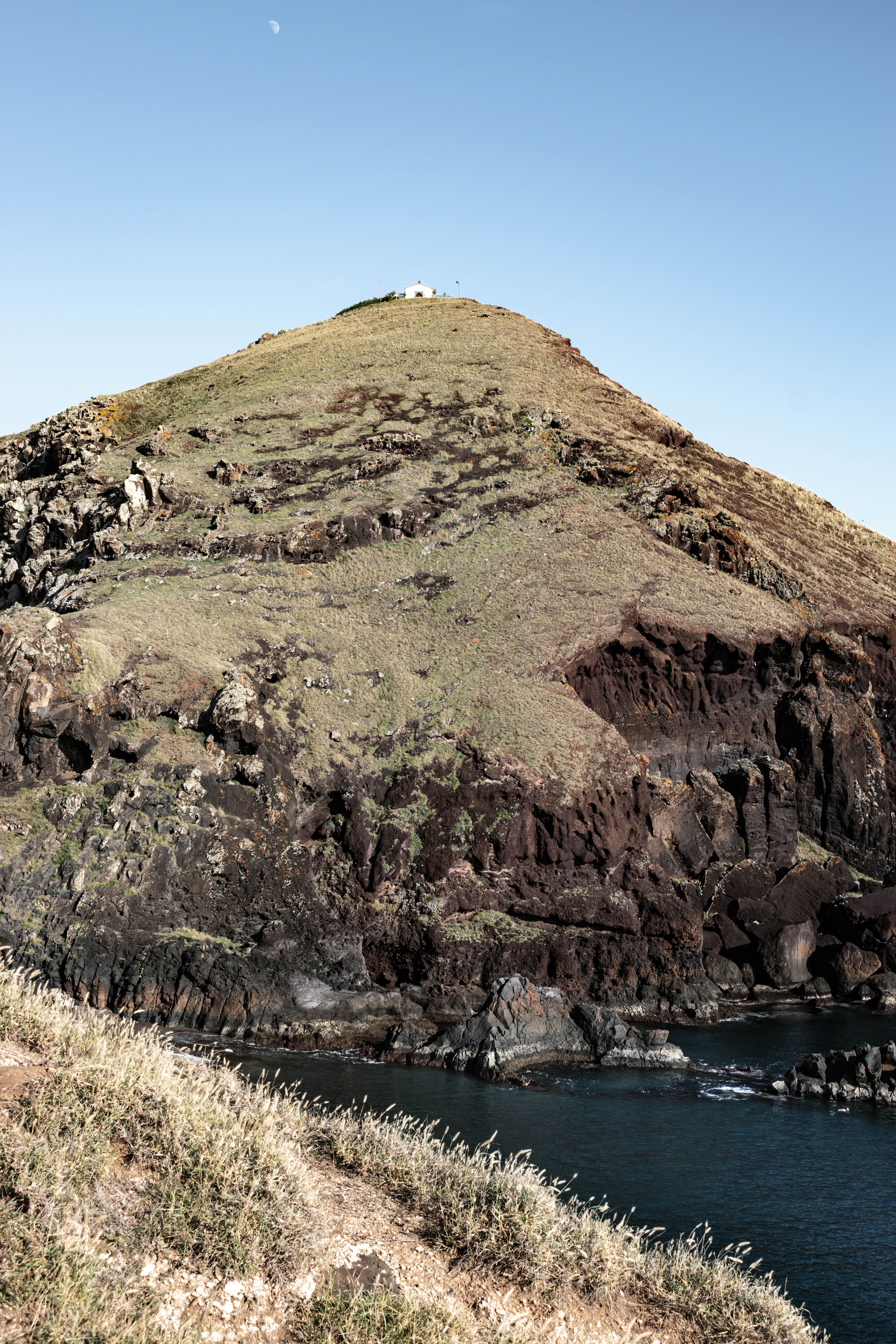 Picturesque hilltop landscape at Ponta de São Lourenço, Madeira with coastal rocks under a clear sky.