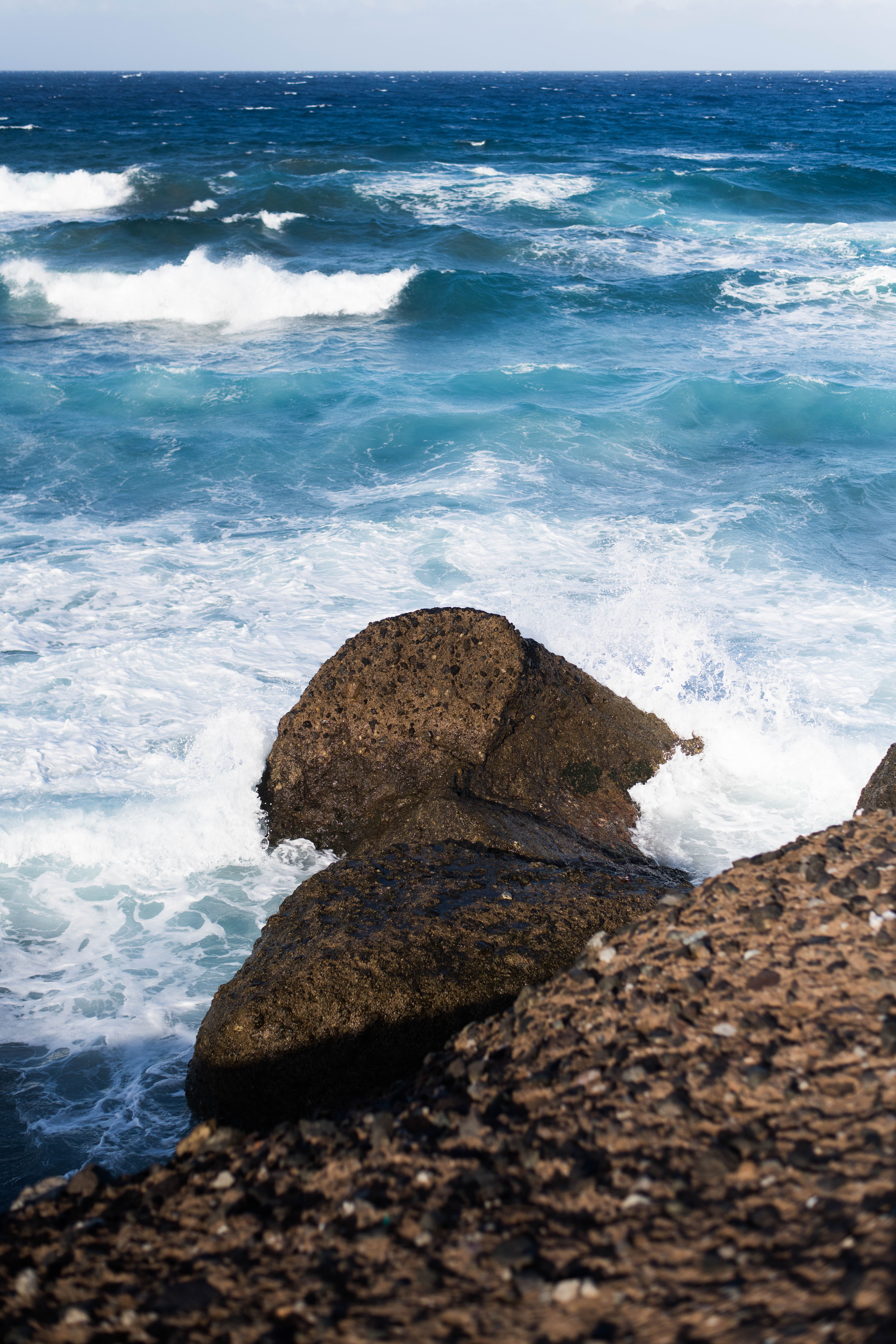 Rugged Coastal Scene with Waves Crashing on Rocks · Free Stock Photo