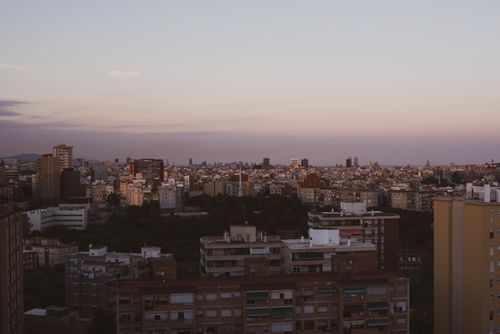 Free A stunning overview of Barcelona's architecture as twilight sets in, showcasing urban density and skyline. Stock Photo