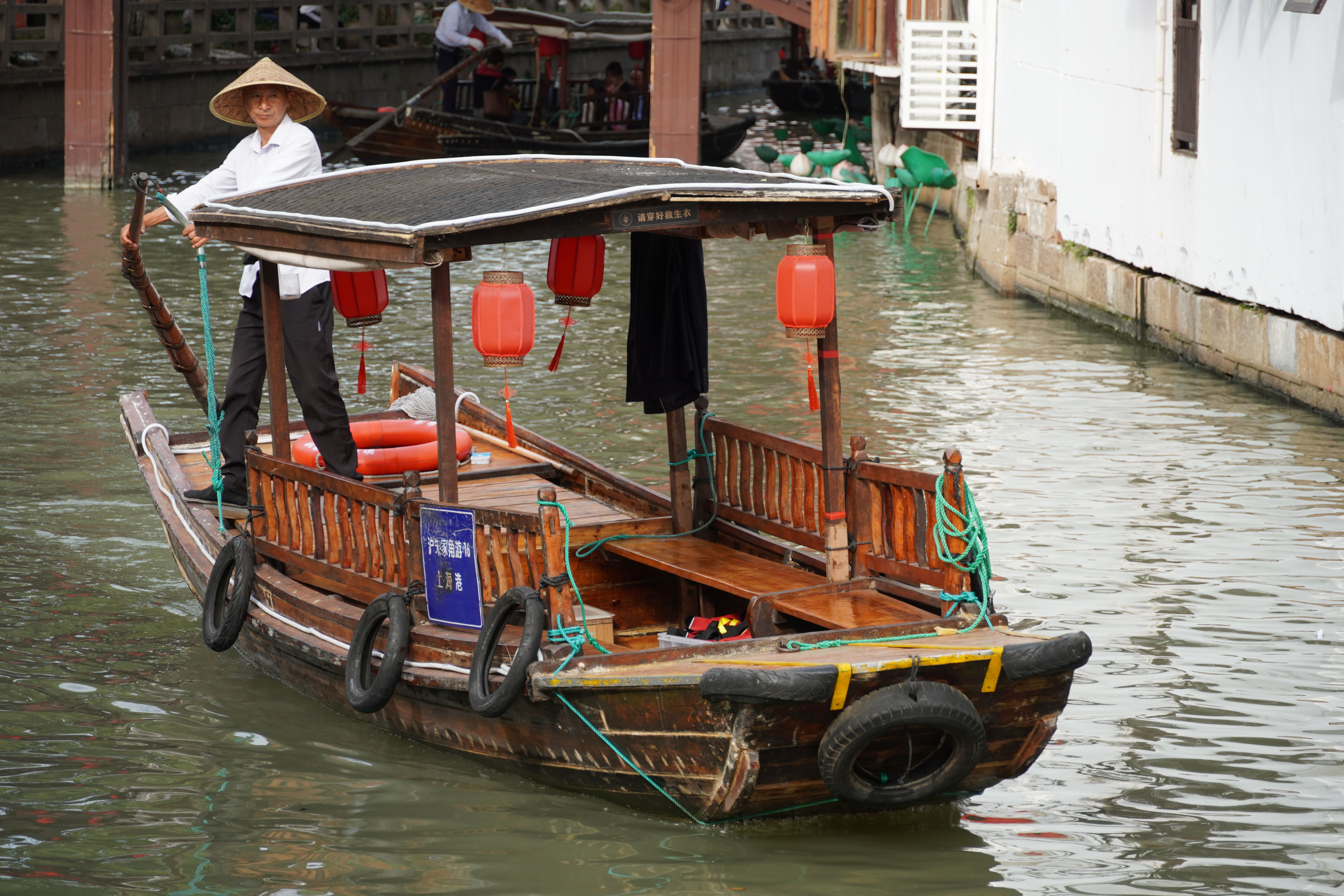 Scenic Canal Boat Ride in Historic Asian Town · Free Stock Photo