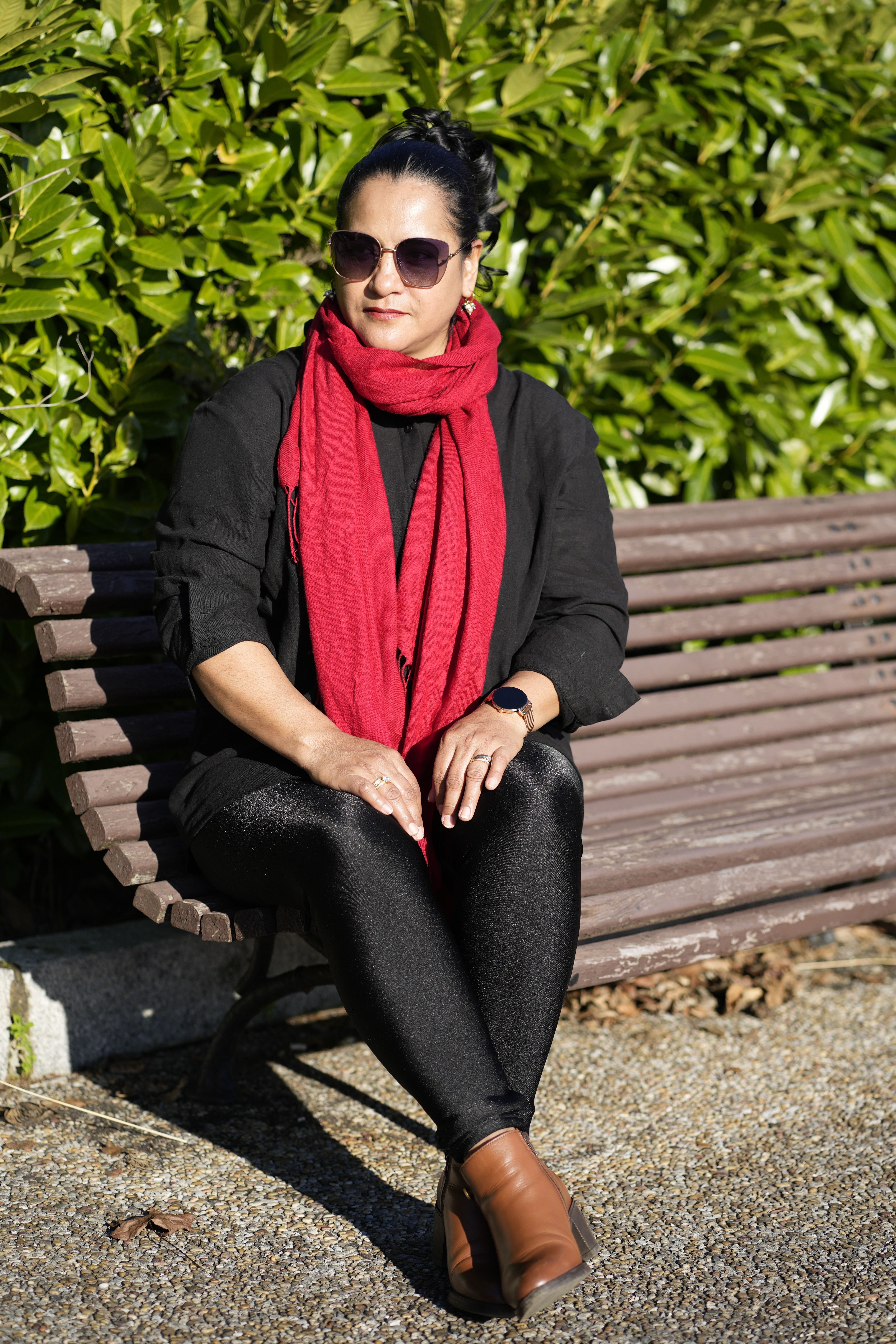 Stylish Woman Relaxing on Park Bench in Autumn · Free Stock Photo