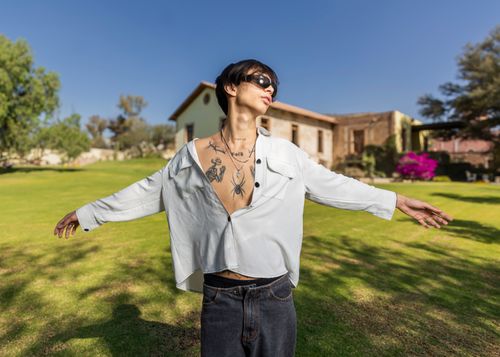Free Trendy individual with tattoos enjoying sunny day in Ibarrilla, Guanajuato, Mexico. Stock Photo