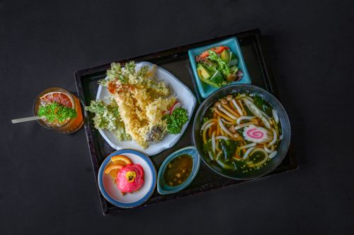 Free A deliciously styled Vietnamese and Japanese fusion meal with tempura and udon. Stock Photo