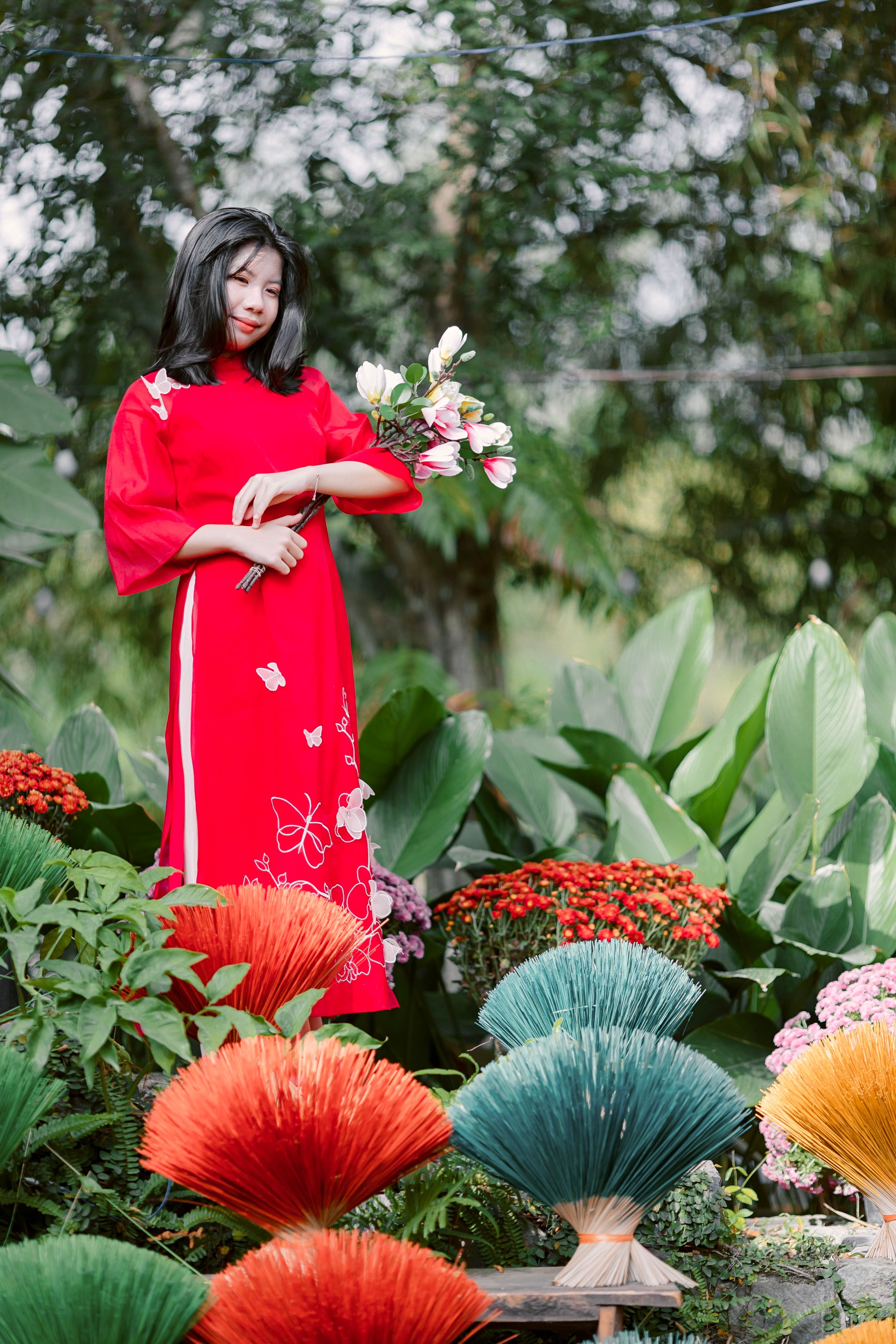 Woman in Red Traditional Dress with Flowers · Free Stock Photo