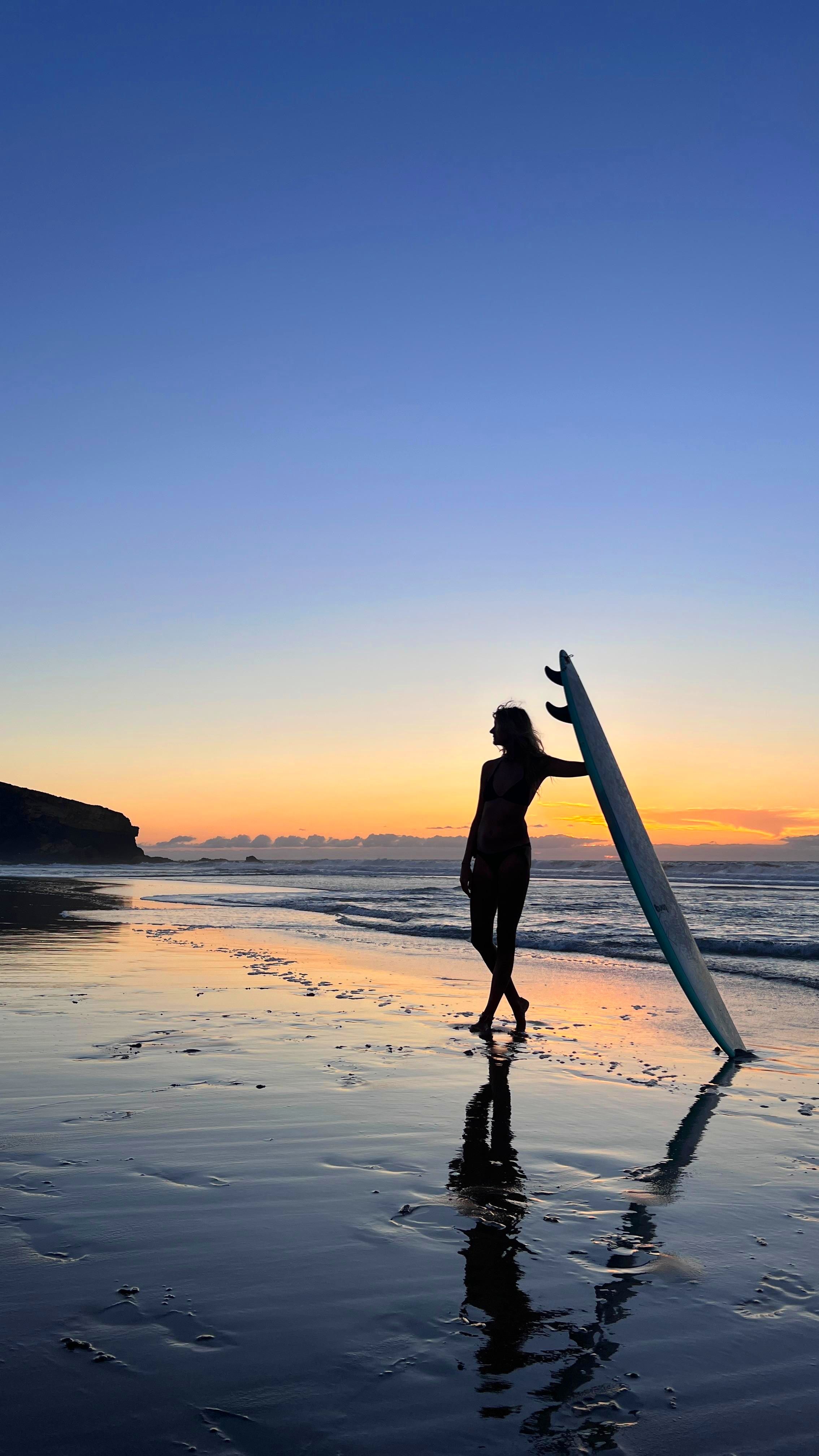 Silhouette of Surfer at Sunset on Beach · Free Stock Photo