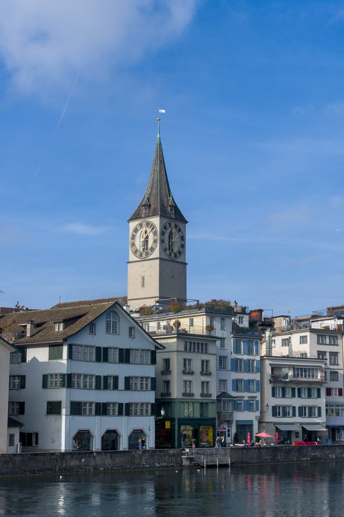Free Stunning view of St. Peter's Church tower in Zurich against a clear blue sky. Stock Photo
