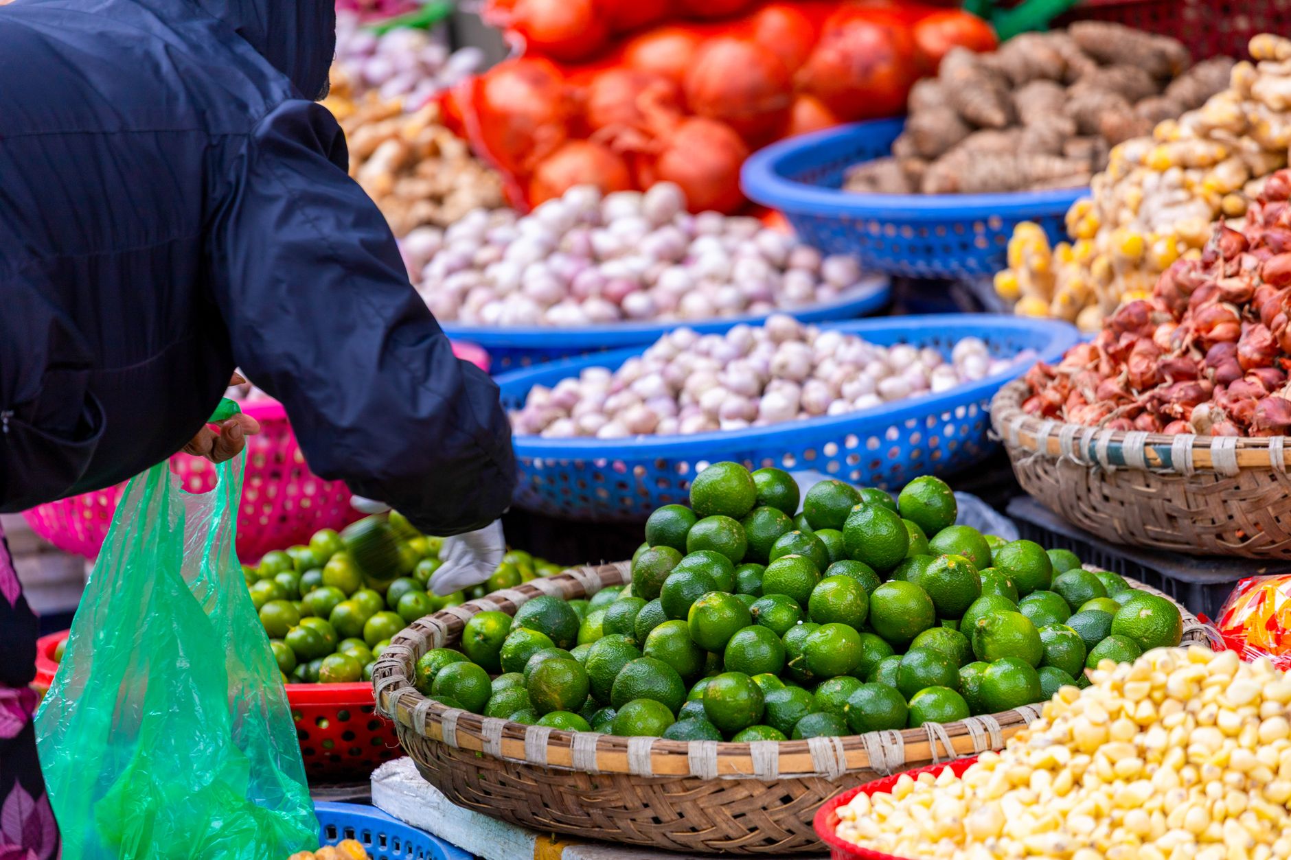 Bright and colorful display of fresh produce at a bustling Hanoi street market.