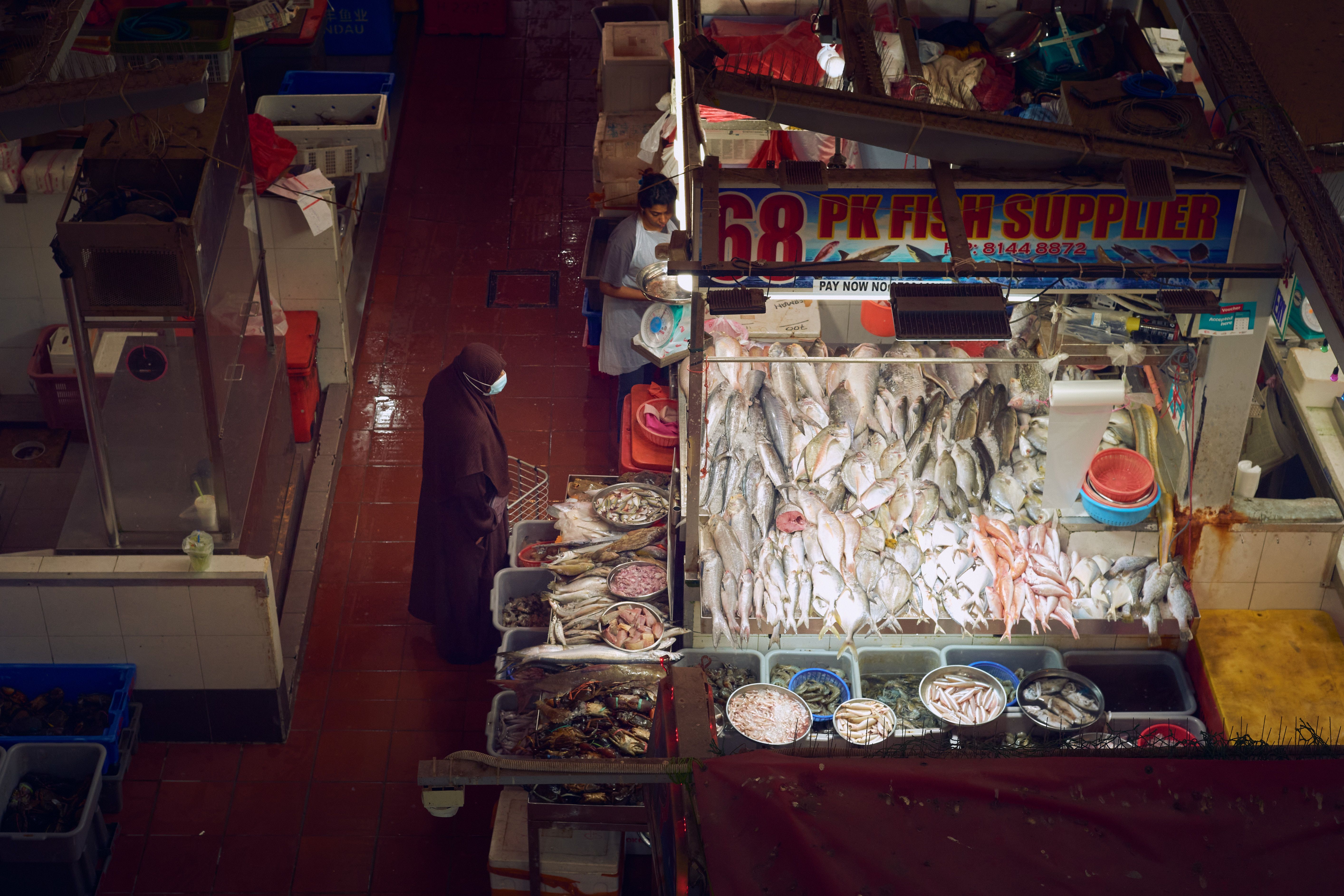 Aerial View of Fish Market with Vendor and Customer · Free Stock Photo