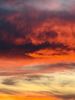 Vivid sunset sky with fiery orange and deep purple hues creating a dramatic scene.