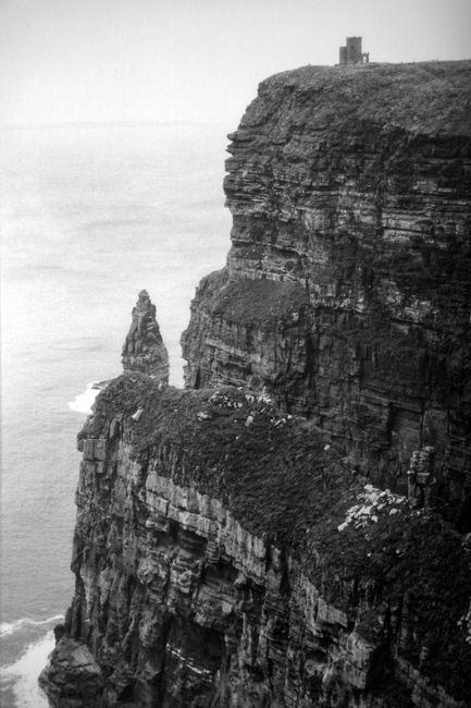Stunning black and white view of the Cliffs of Moher, capturing their dramatic beauty along Ireland's coast.