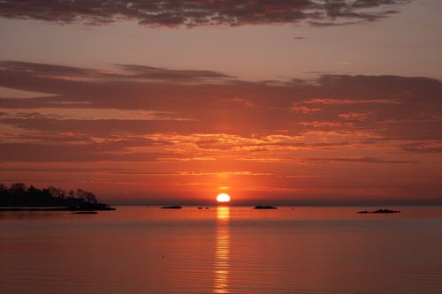 Free Capture the tranquil beauty of a sunrise over calm waters at Cove Island Park, Stamford. Stock Photo