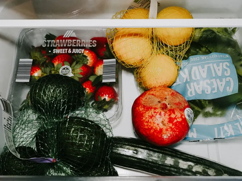 Fresh fruits and vegetables in a refrigerator crisper drawer Fresh fruits and vegetables in a refrigerator crisper drawer