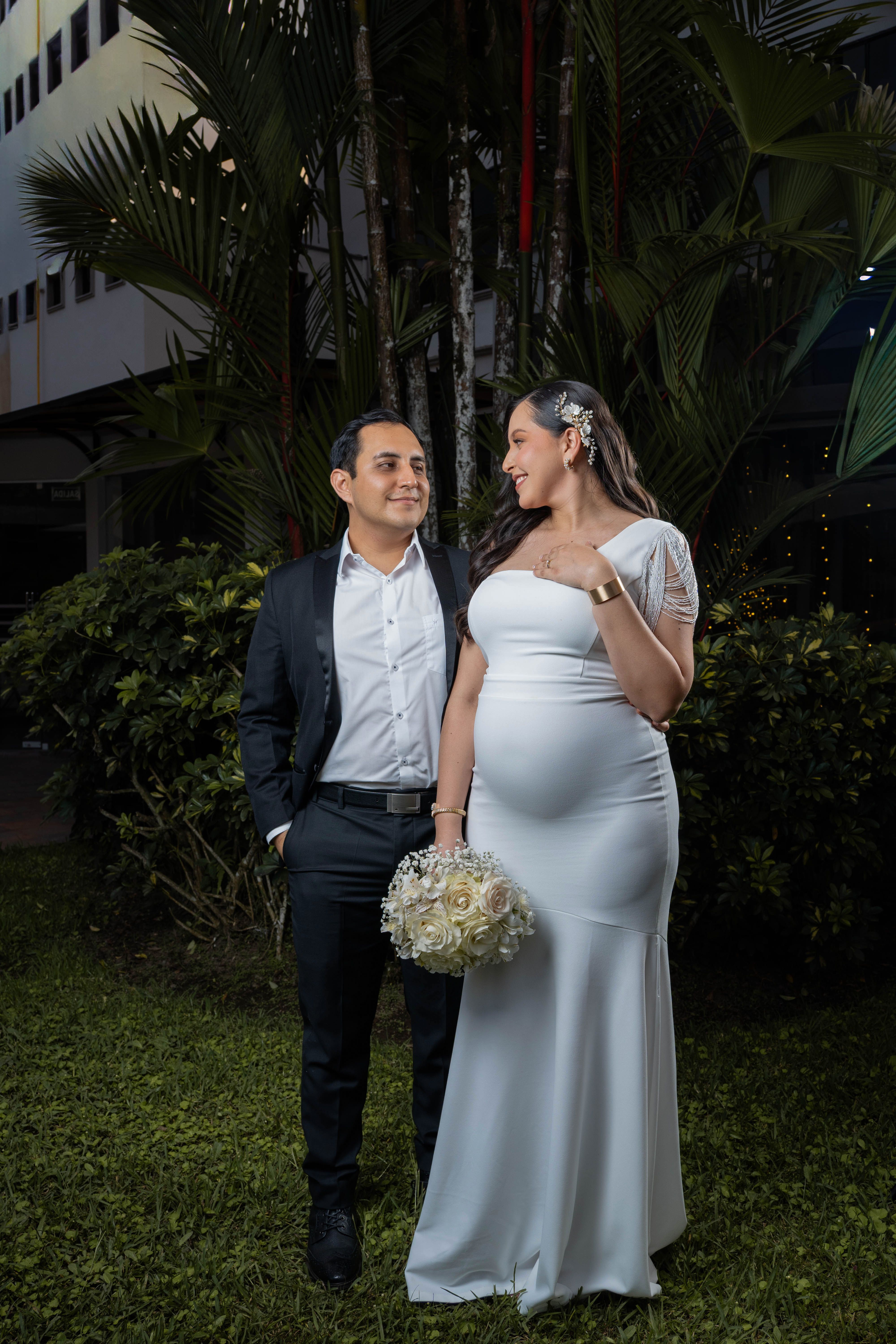 Stunning outdoor couple portrait featuring a pregnant bride in Ecuador.