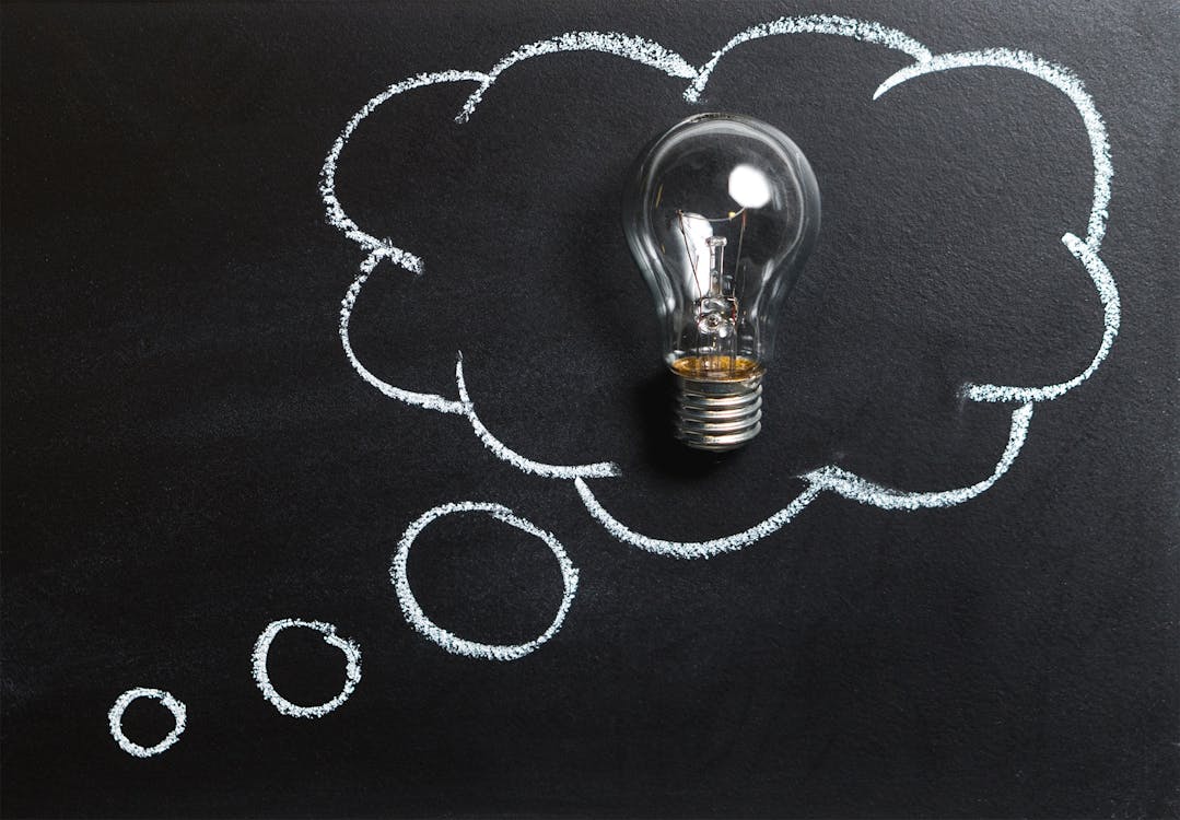 Free Clear Light Bulb Placed on Chalkboard Stock Photo