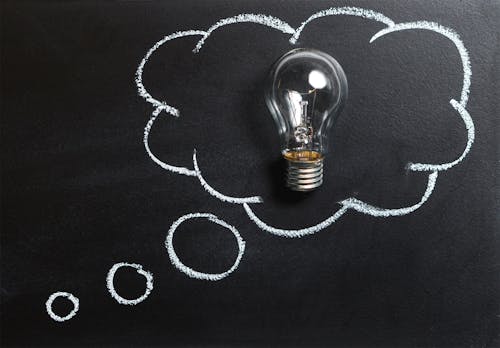 Free Clear Light Bulb Placed on Chalkboard Stock Photo