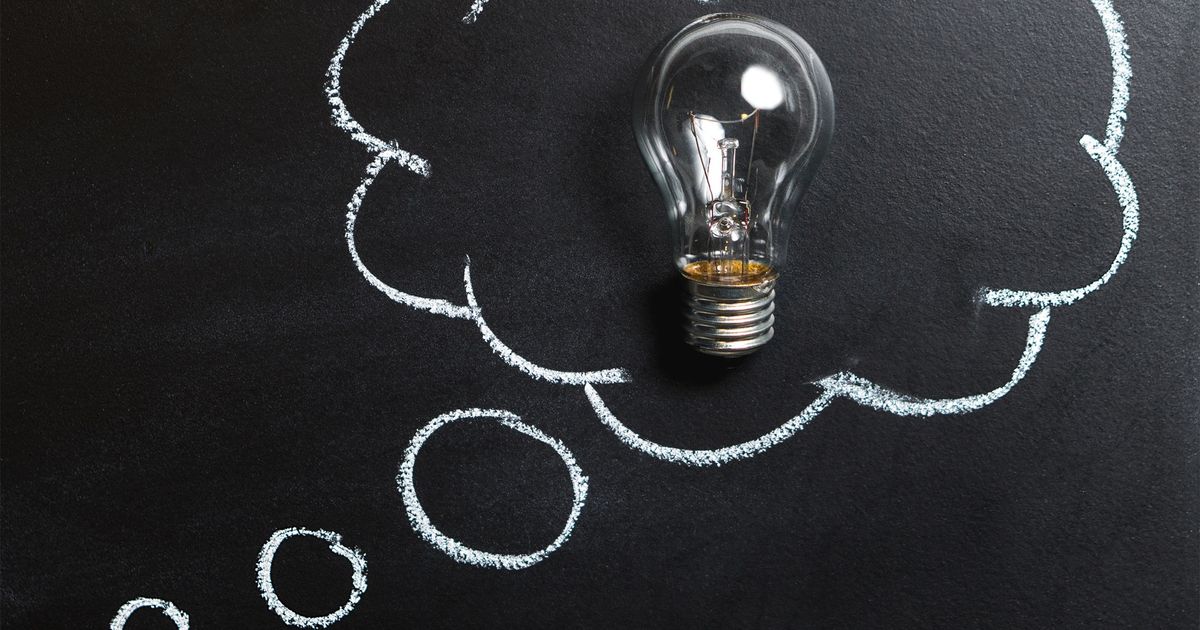 Light bulb resting on a chalkboard representing content ideas