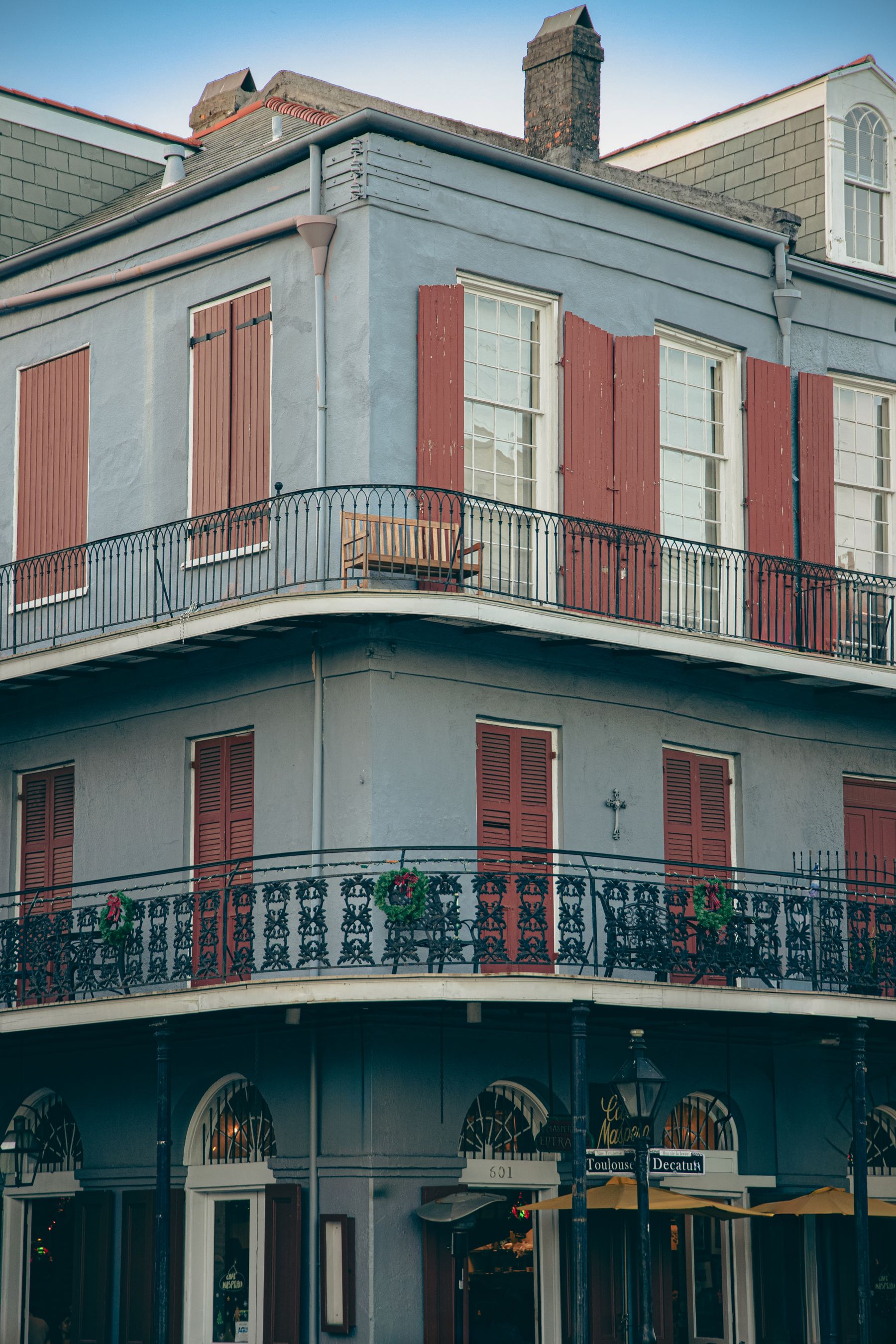 Historic French Quarter building in New Orleans with iron balconies and shutters in the Vieux Carre Historic District.