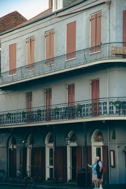 Classic French Quarter building with wrought iron balcony in New Orleans