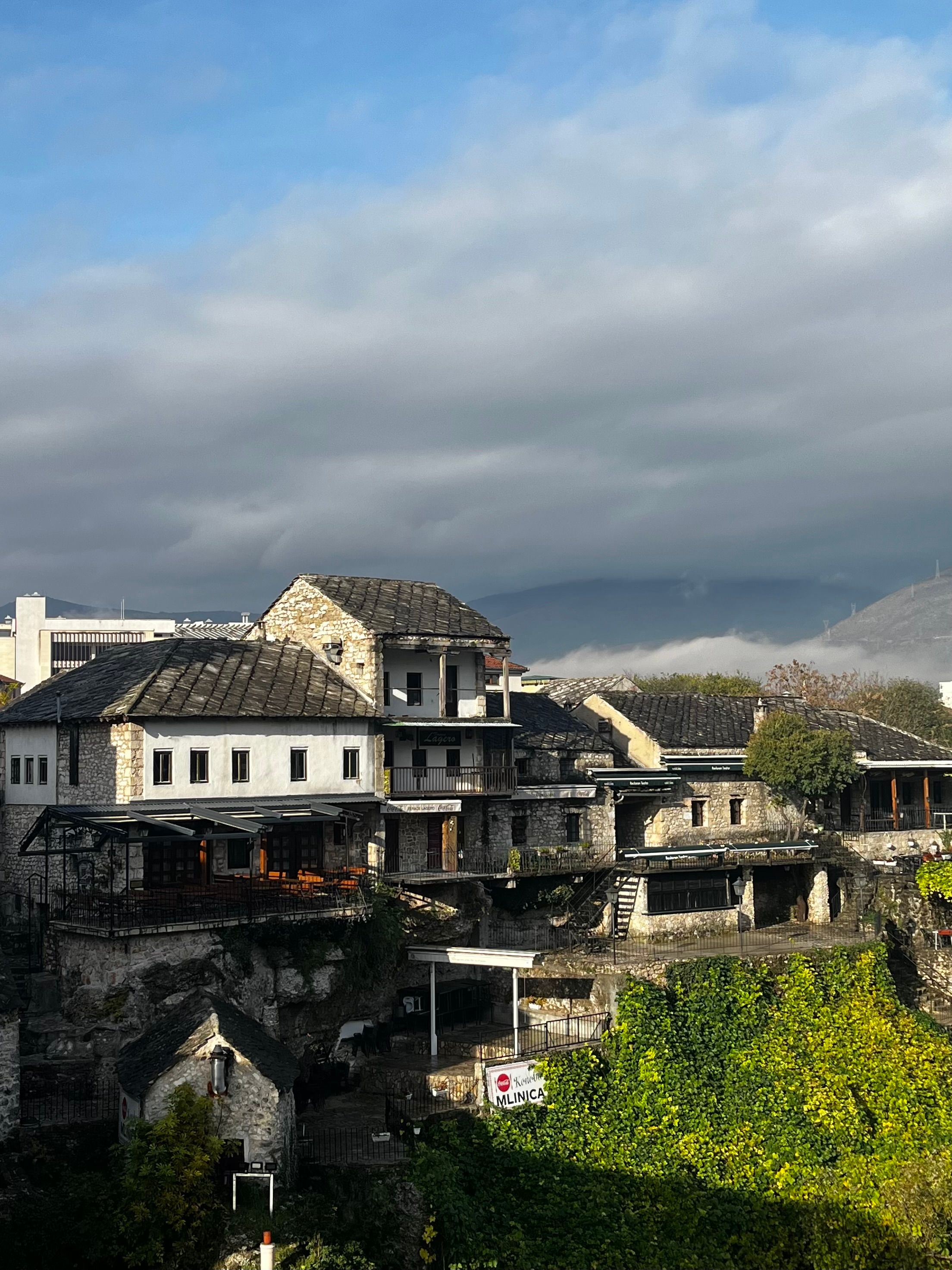 Historic Stone Buildings Under Cloudy Sky · Free Stock Photo