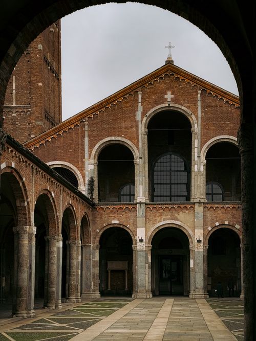 Free Explore the stunning architecture of a historic basilica in Milan, Italy, showcasing elegant arches and intricate brickwork. Stock Photo