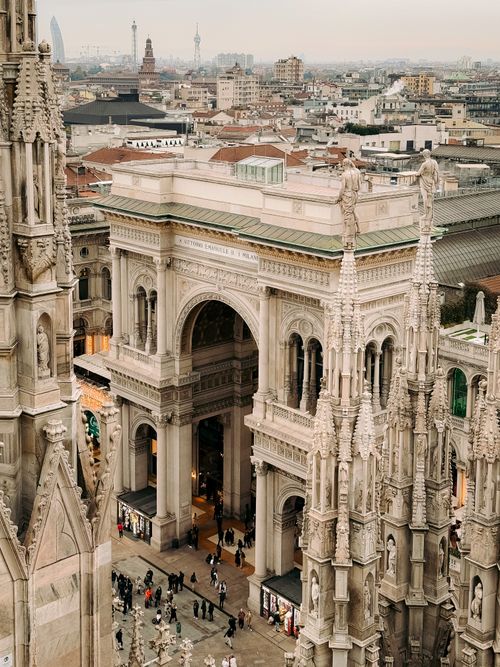 Free Stunning aerial view of Galleria Vittorio Emanuele II and Milan skyline, capturing Gothic architecture. Stock Photo