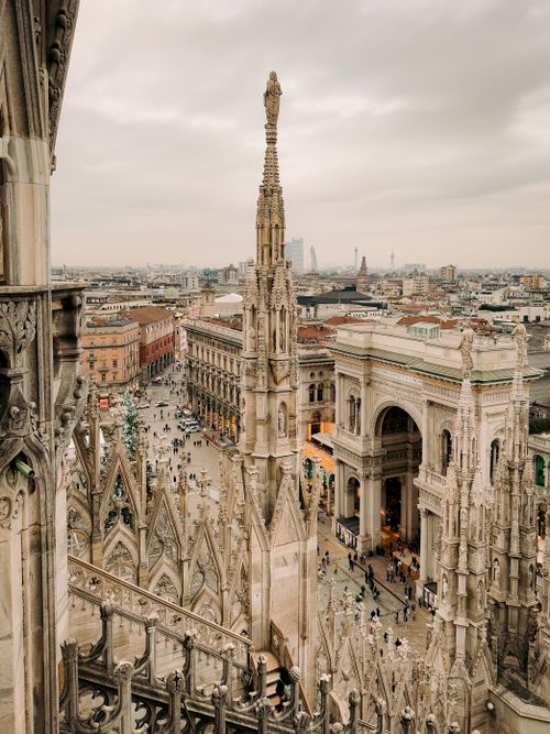 Free Stunning aerial view of Milan's Duomo with intricate architecture and bustling city life. Stock Photo