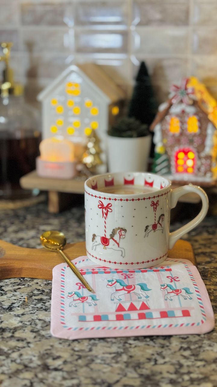 Warm fairy lights wrapped around the frame of a coffee bar hutch