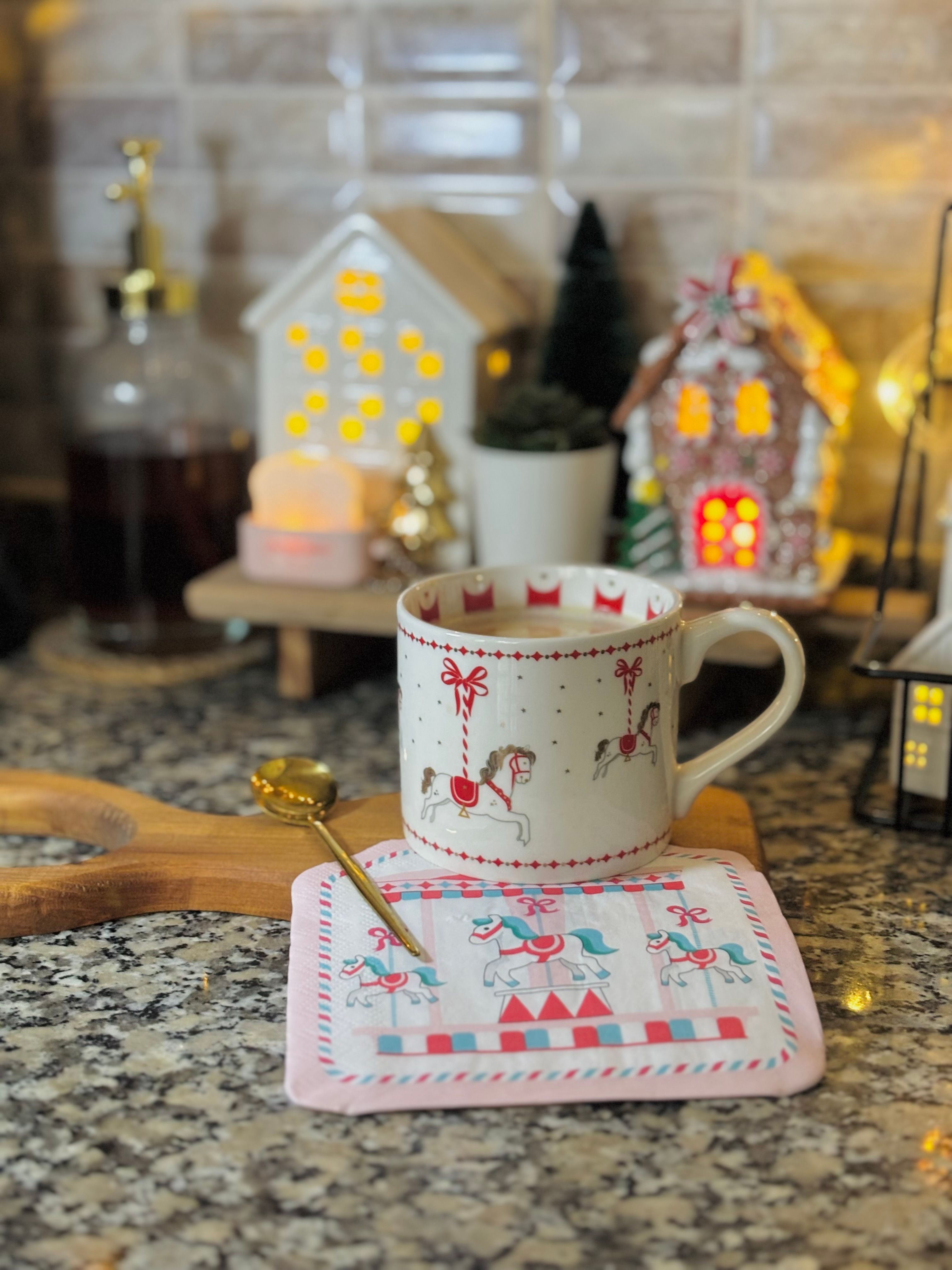 Cozy Festive Mug with Carousel Horse Motif · Free Stock Photo