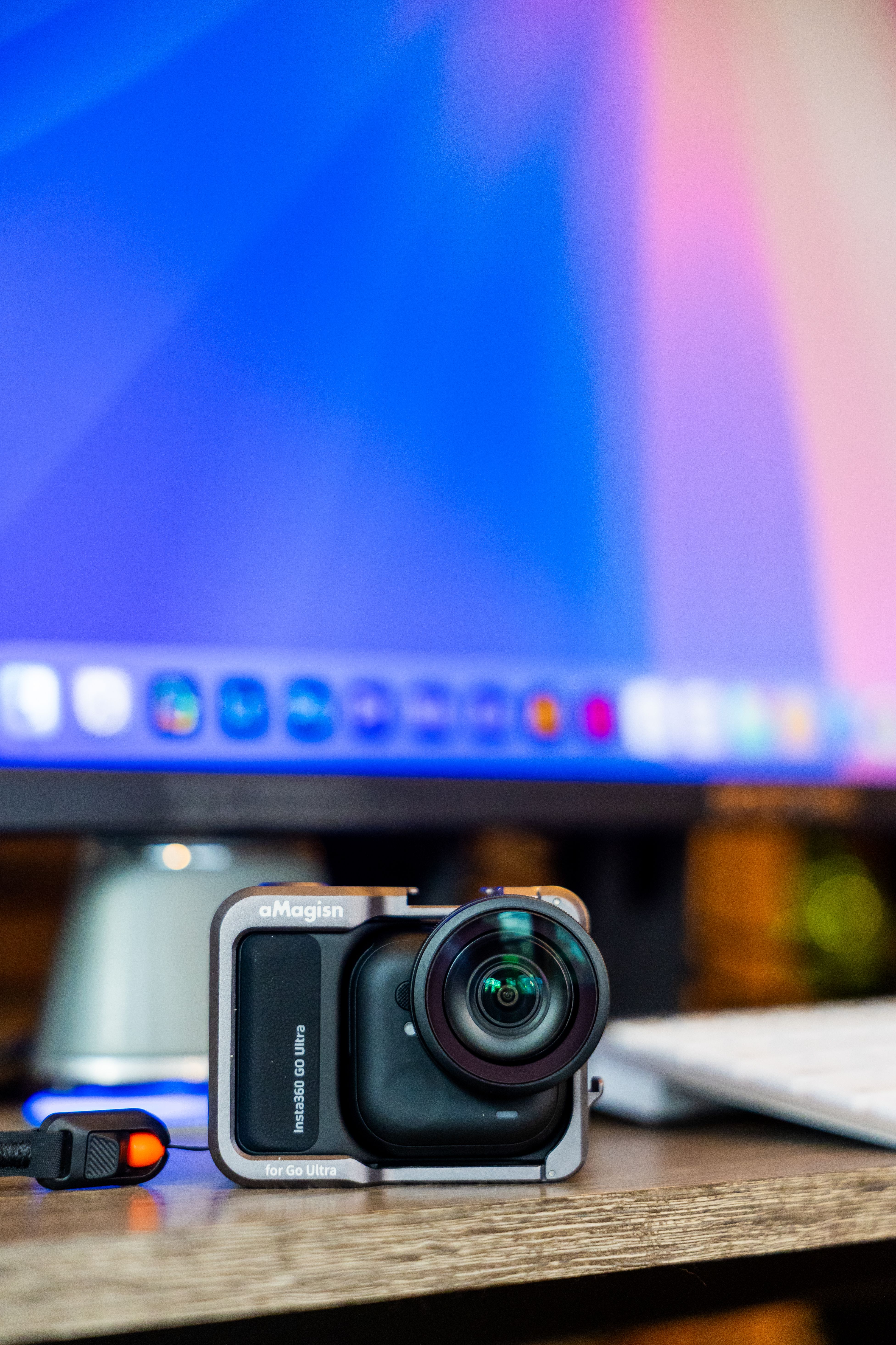 Compact Action Camera on a Desk with Monitor · Free Stock Photo