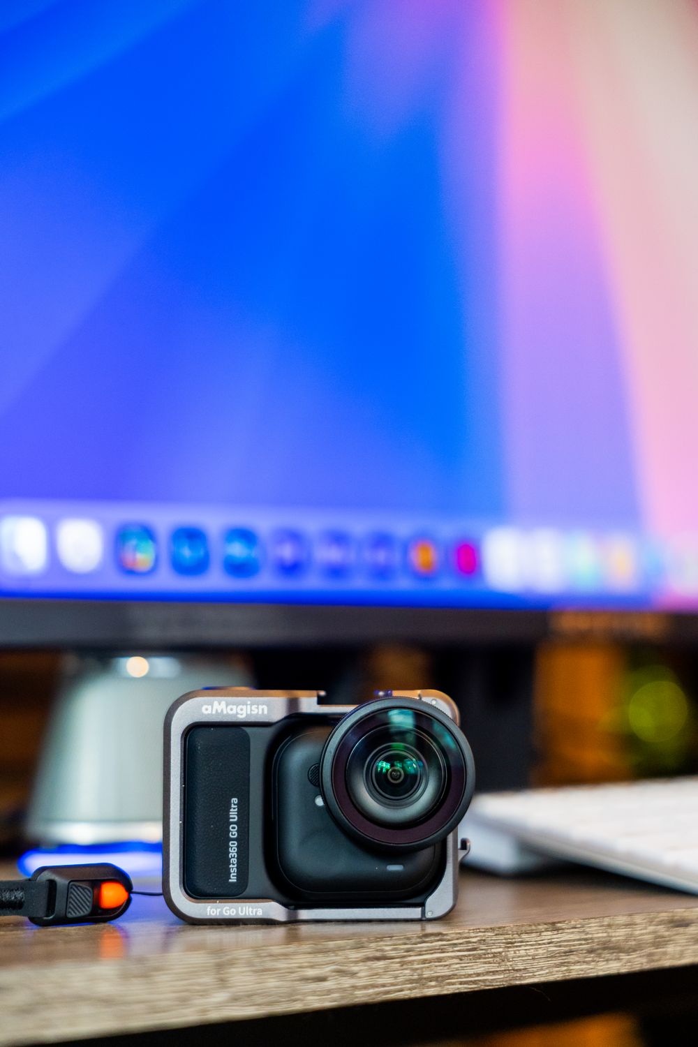 Compact Action Camera on a Desk with Monitor · Free Stock Photo