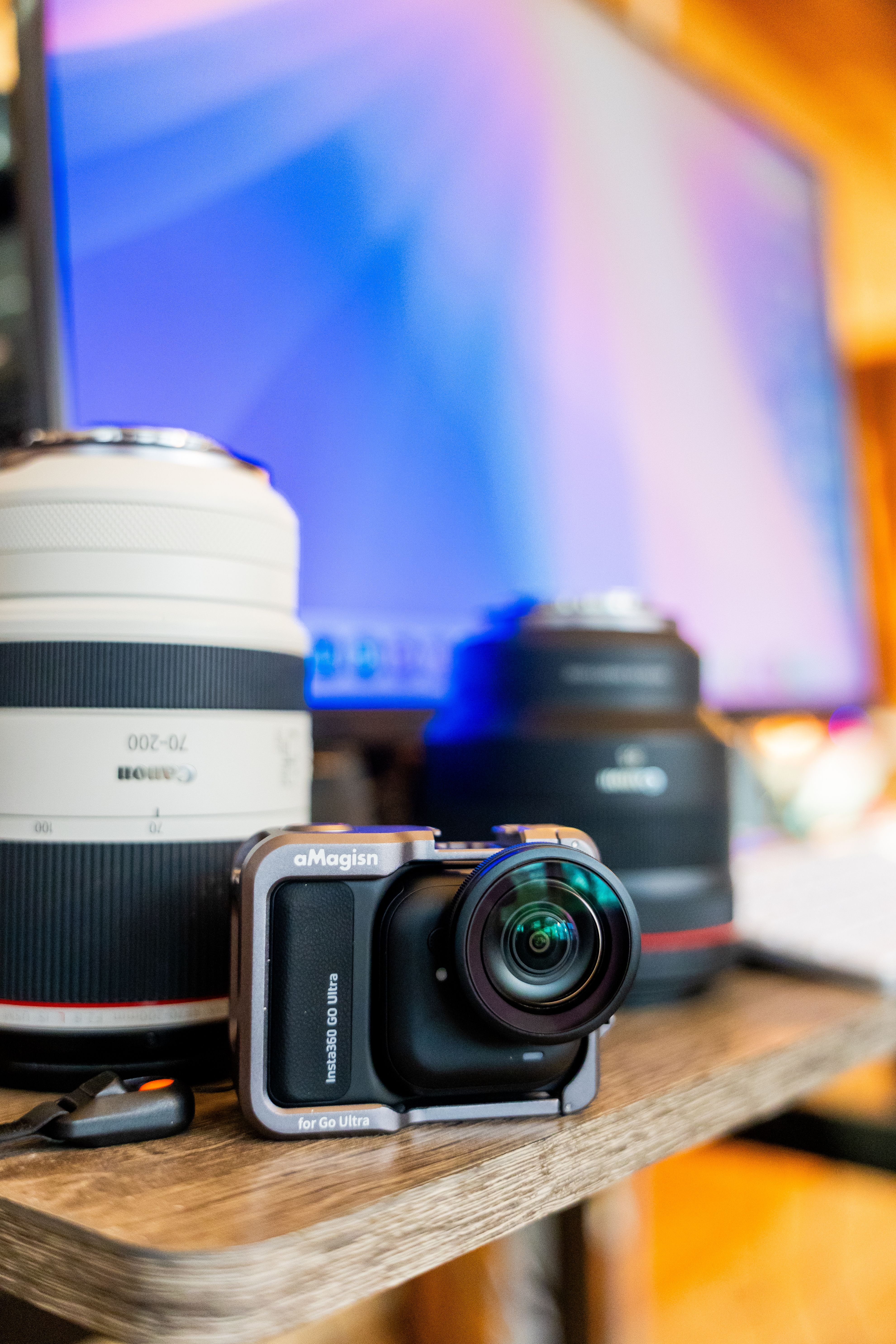 Camera equipment on a wooden desk · Free Stock Photo