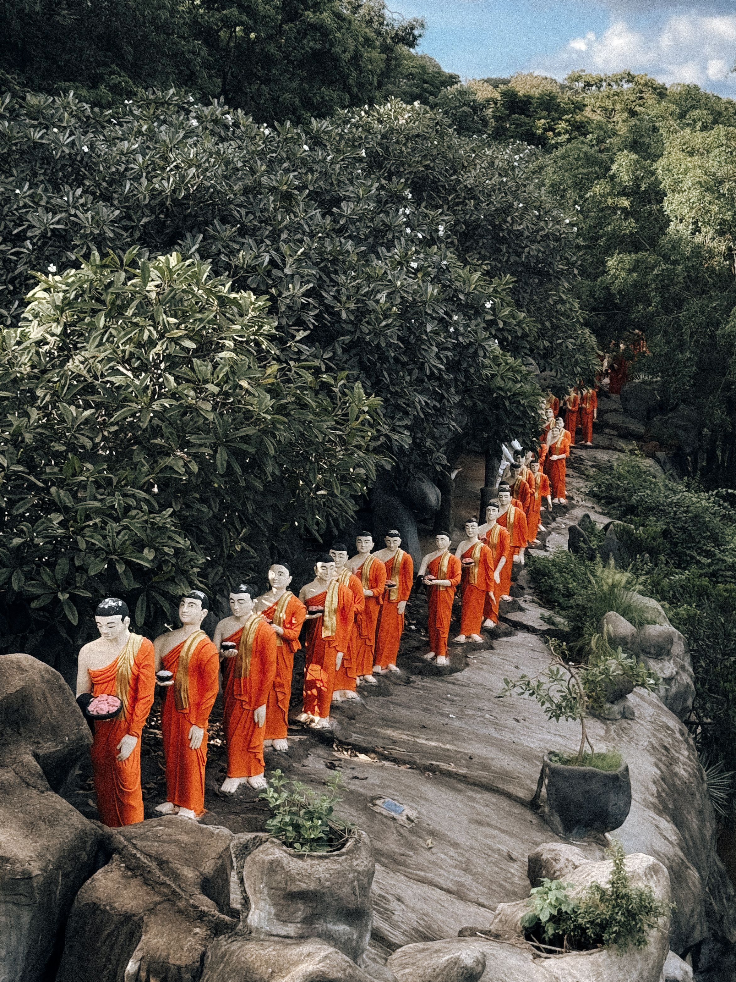 Monks Fall Inline on Sidewalk · Free Stock Photo