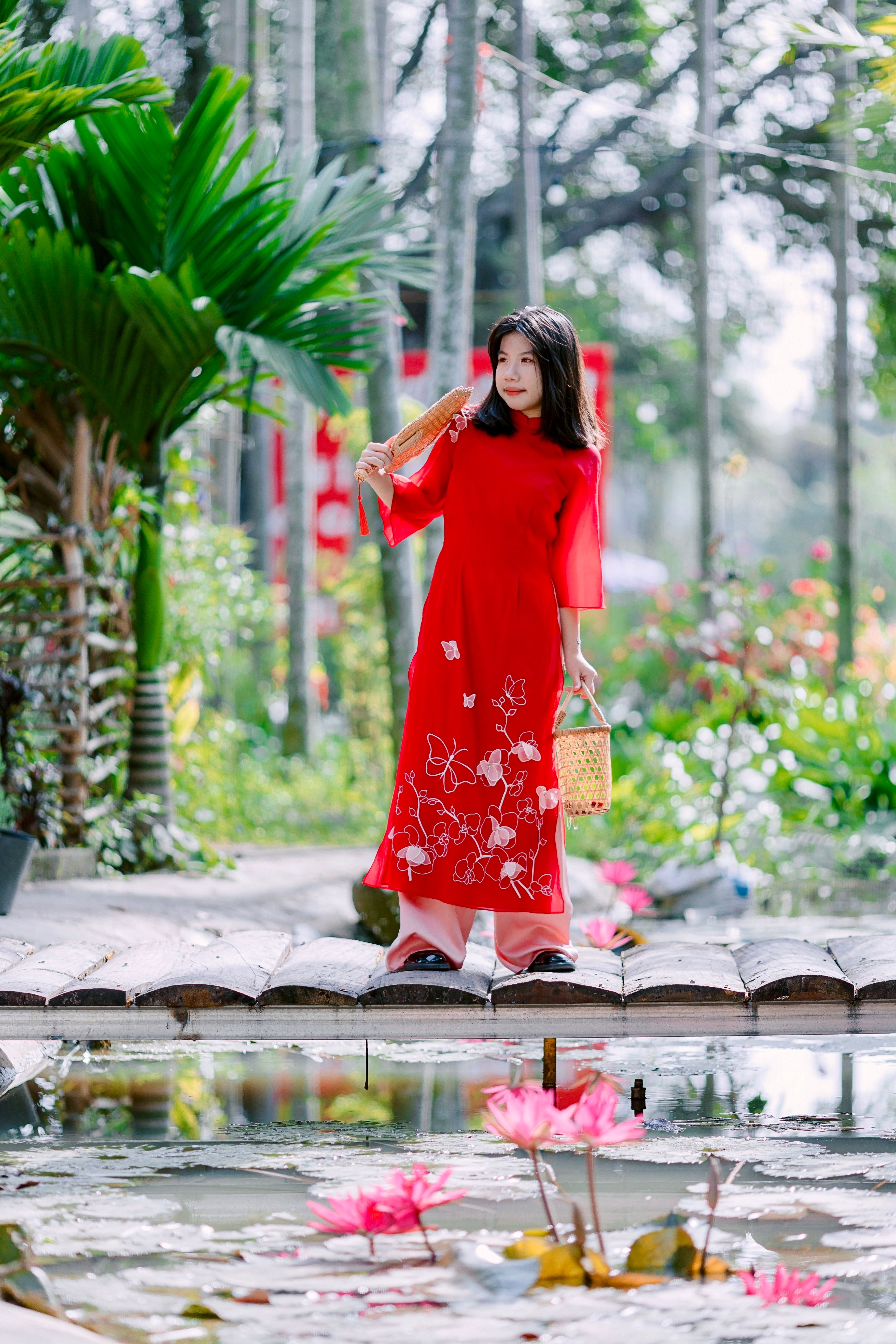 Elegant Woman in Traditional Red Dress by Pond · Free Stock Photo