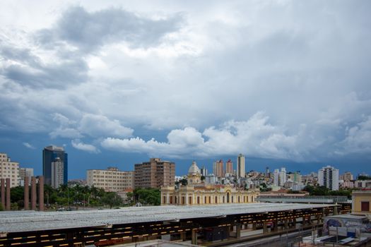 Skyline of Belo Horizonte with historic architecture and cloudy sky backdrop.
